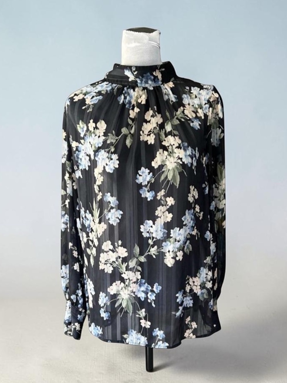 H&M black floral blouse with white and blue flowers, size L